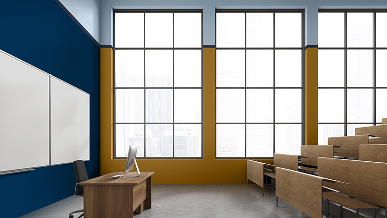 Classroom with floor to ceiling windows and split blue wall 
