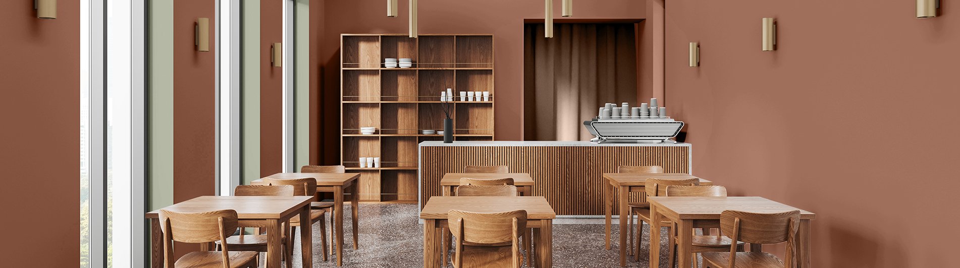 Café-Bereich mit Tischen und warmen Terrakottawänden