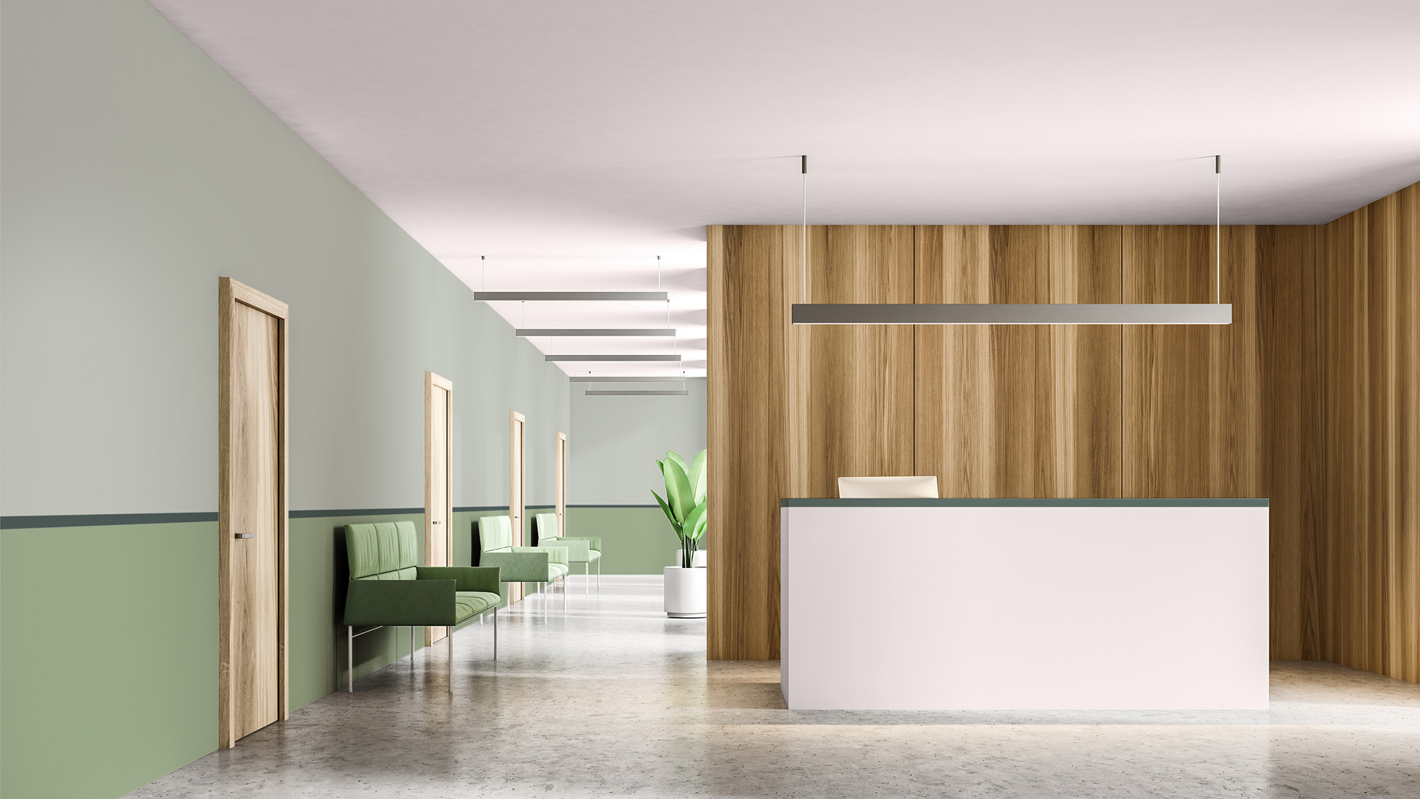 Ein Wartebereich mit Wänden, die mit einer optischen Wandaufteilung gestrichen sind, die zwei verschiedene Grüntöne kombiniert
