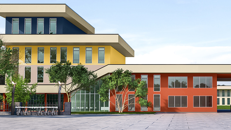 Eine Schulfassade in gelb, blau und orange