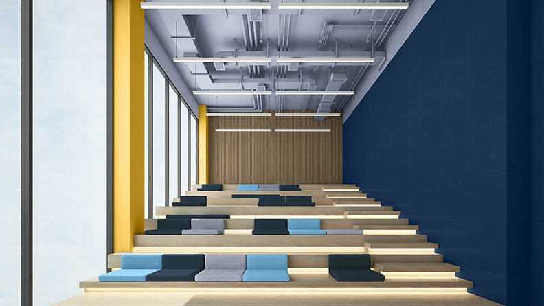 Ein moderner Theatersaal mit einem dunkelblauen und gelben Anstrich 