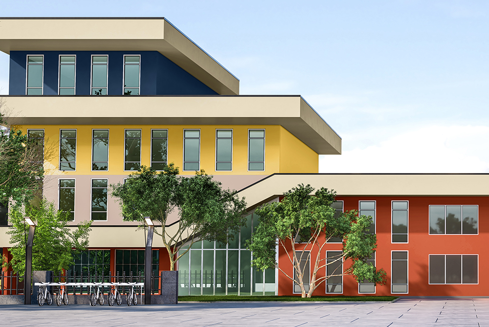 The exterior of a school brightly painted in yellow, blue and orange colours