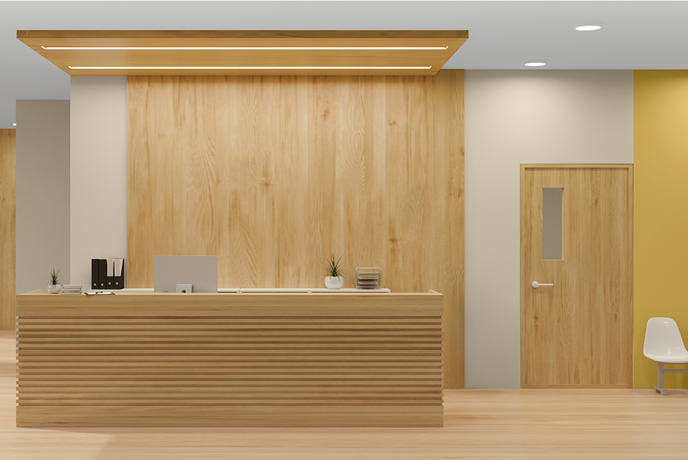 A modern wooden reception area with yellow statement walls behind